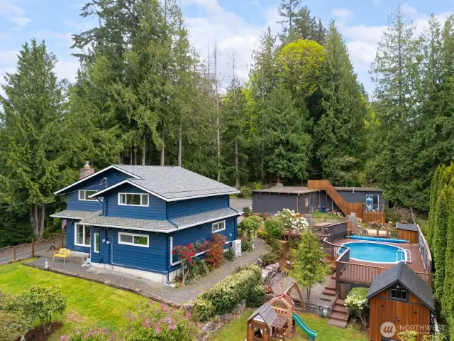 Another view of the front and side yard of the home. The front yard is fully fenced, too. There is just so much to do here...it is like going to "camp"!