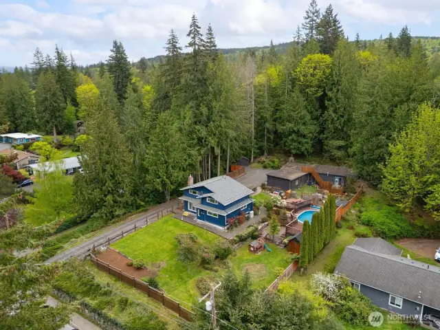 Looking down from above you can see how private this home is and all of the outbuildings and the pool.