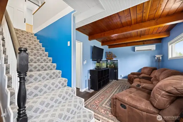 There is a family room on the main floor that also has the wood ceiling and a mini split for heating and cooling.