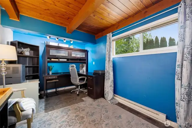 This main floor bedroom is quite large and also has the wood ceiling with the beams. This room is generously sized with a large closet.