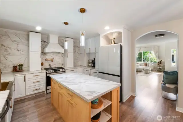 This kitchen is a showstopper! Look at that beautiful island with built-in storage and seating.