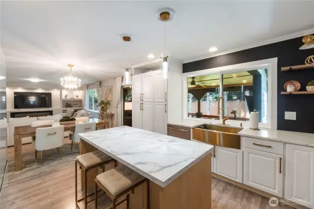 There is a large pantry to the left of the window.