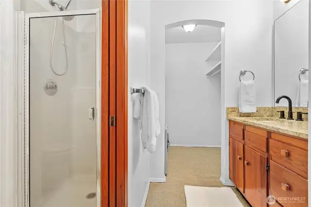 The primary ensuite 3/4 bathroom with walk-in closet