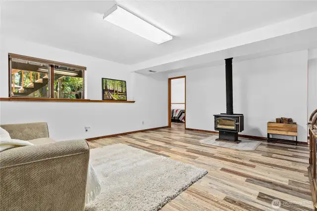 Downstairs bonus room, with a view to the 3rd bedroom downstairs