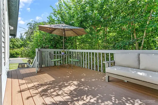 The upper deck with a view to the front yard & front door entry