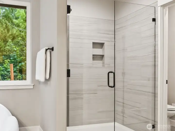 Bathroom features duel headed shower and heated floors.