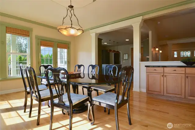 French doors open onto the second story deck across the back of the home. The kitchen is conveniently close by...stepping through the columed entry makes entertaining easy.