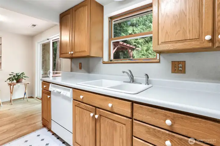 Kitchen looking out on deck & Back yard.