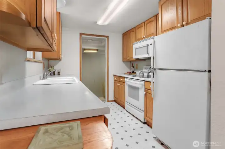 Kitchen leads to family room area.