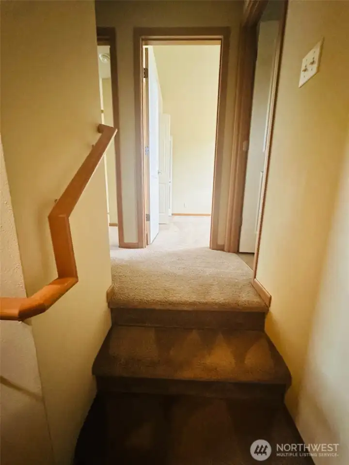 Upstairs to 2 bedrooms and 1 full bath