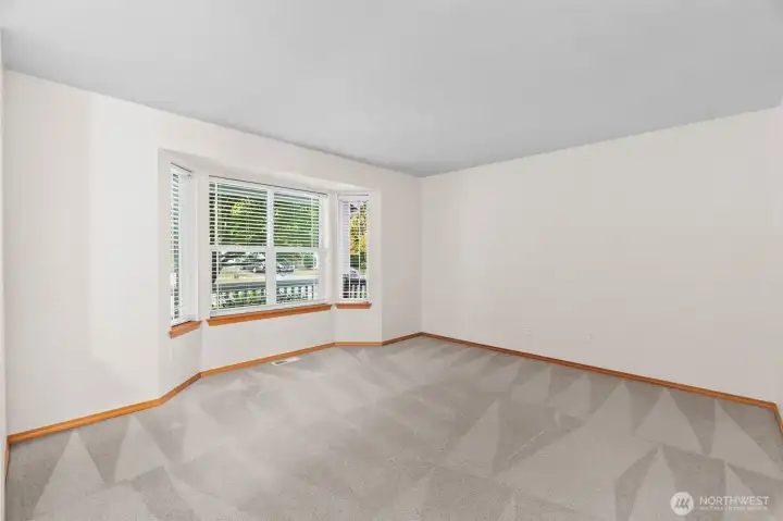 This is the front living room overlooking the front porch. Could be living space, office, or TV room. Lots of options.
