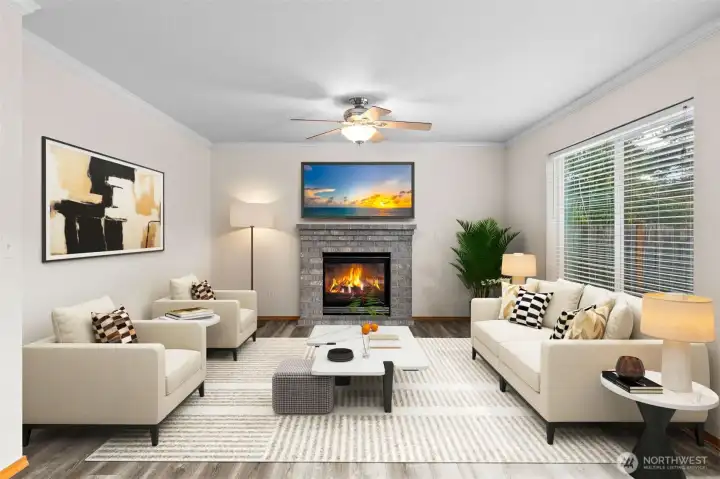 The family/great room (vitually staged). Lots of space and a large picture window brings in plenty of light.