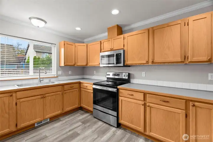 Lots of Cabinets & Counterspace, stainless steel sink and appliances.