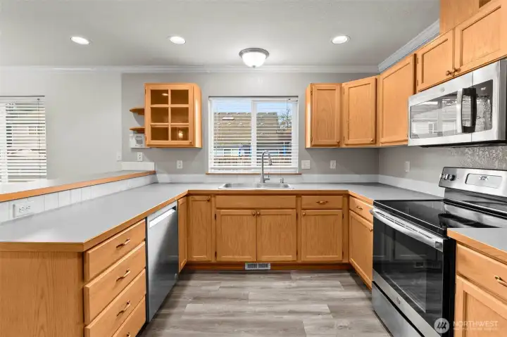 Roomy kitchen overlooks the dining area and family/great room.