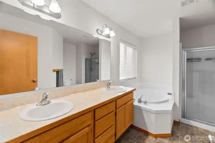 Primary bathroom with dual sink vanity and lots of room.