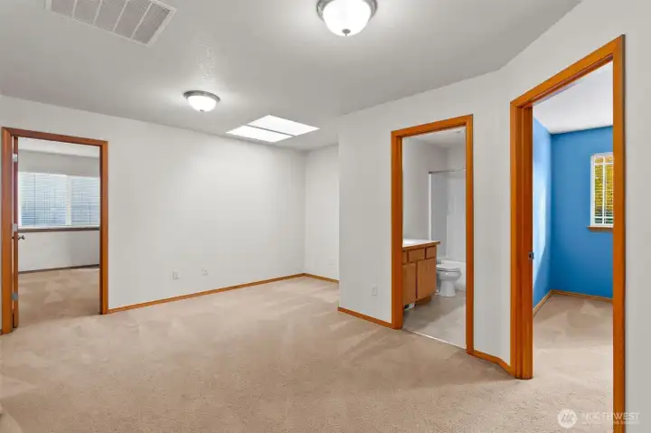 The upstairs loft, surrounded by 4 bedrooms and a full bathroom.