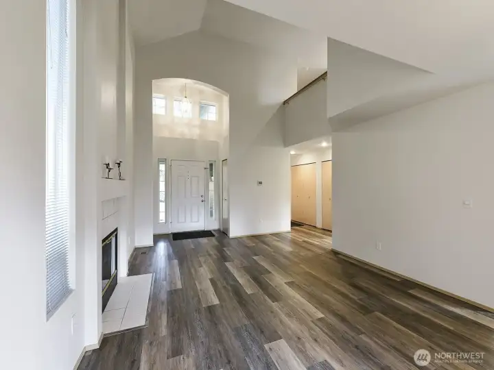 Luxury Vinyl Plank flooring throughout main floor.  Open breezeway/hallway upstairs between primary bedroom and other two bedrooms.