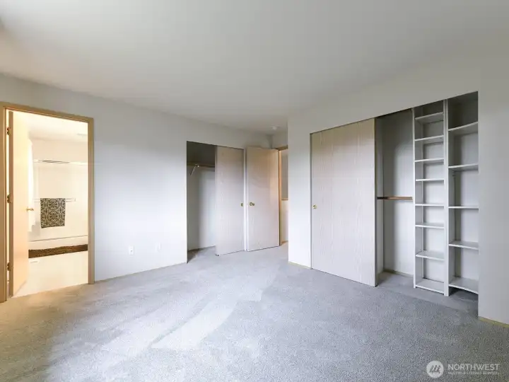Primary bedroom, looking into ensuite bath and closets.  So much storage!