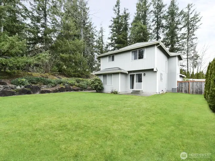 View of terraced side yard that raps around to the front of house.  So many beautiful things planted there!  Just wait until spring!