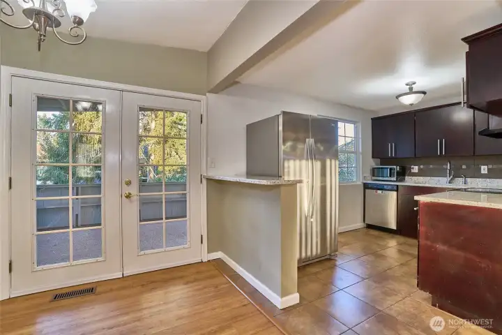 View from the Dining Room looking into the Kitchen and Covered Deck.
