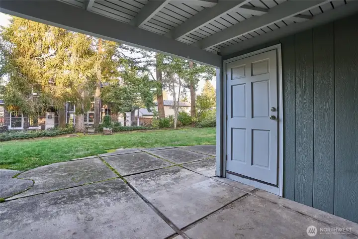 Downstairs Patio with a Large Storage Unit to the Right.