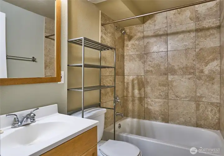 Downstairs Full Bathroom with Tile Surround Shower.