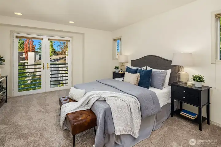 Spacious primary suite with private balcony