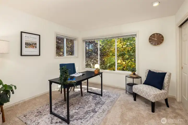Corner windows bring light to the bedroom from two different directions