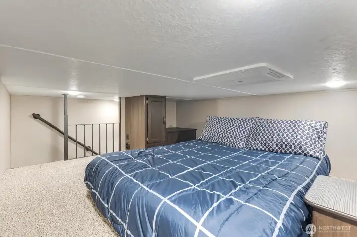Loft sleeping area with storage