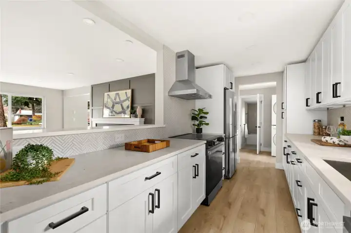 Luxury galley kitchen with custom cabinets, Quartz counters, luxury SS appliances and Italian tile backsplash.