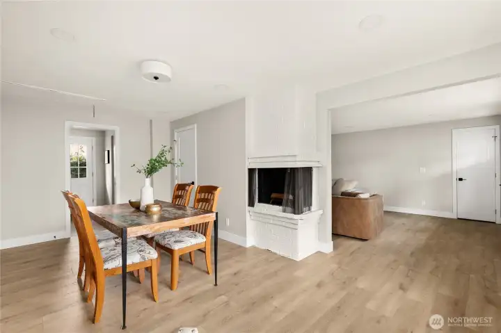 Light, bright dining/flex space with cozy wood burning firplace