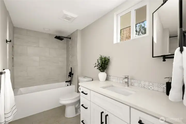 2nd full bathroom with custom vanity, Quartz counters, Italian tile floors and luxury soaking tub.