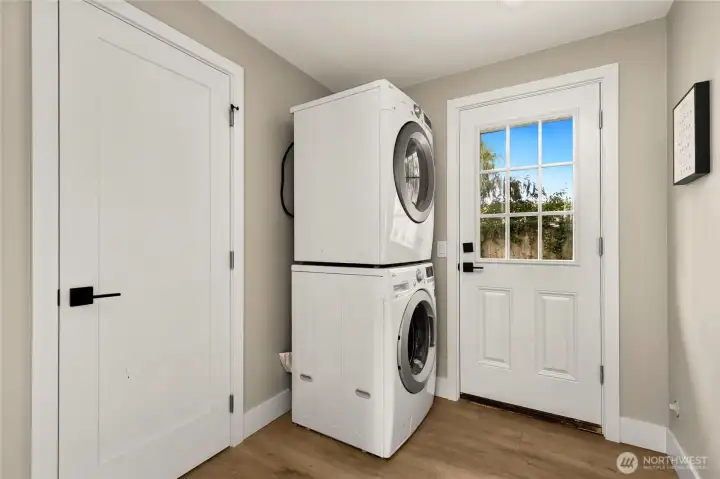 Stackable laundry space with access to rear yard.