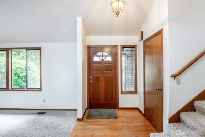 Front entry with natural hardwood floors.