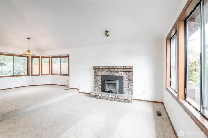 Bursting with natural light from the large windows and vaulted ceilings.