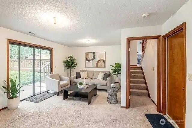Lower level family room with sliding glass door to rear yard.