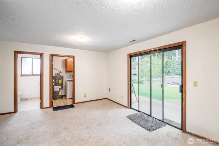 Family room with half bath and utility room.