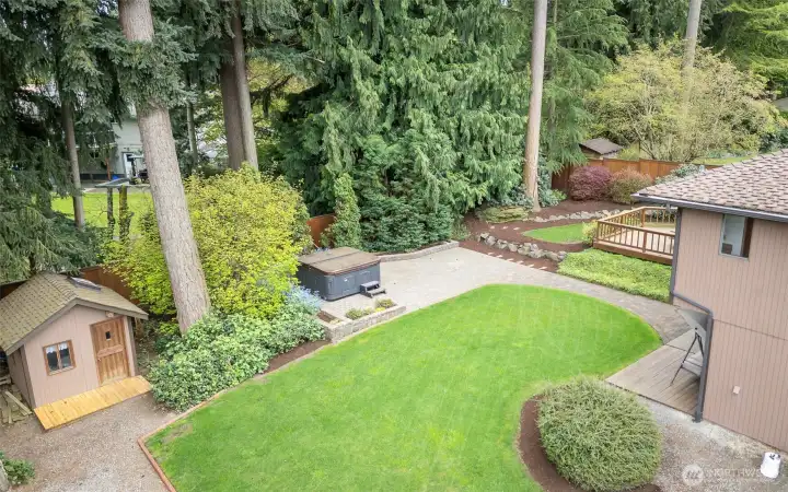 Huge rear yard with natural greenbelt creating a semi-private setting.