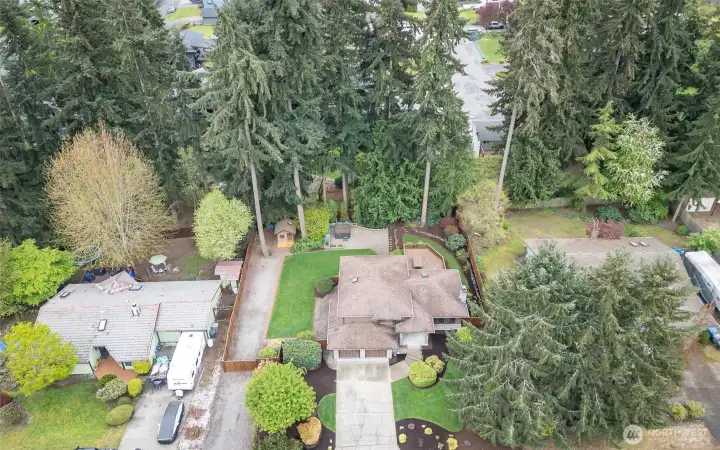 Beautiful setting w/natural greenbelt creating semi-private space. Entertainable size deck w/picnic table, hot tub, shed for gardening and parking for RV/boat/toys.