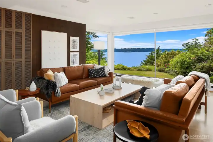 Large living room with original paneling and views of Puget Sound Large living room with original paneling and views of Puget Sound