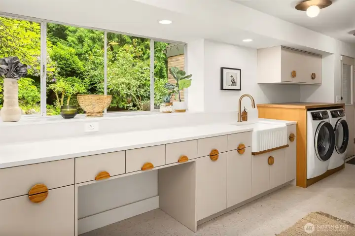 Large laundry room with washer and dryer, lots of storage as well as pull out drying racks. Large laundry room with washer and dryer, lots of storage as well as pull out drying racks.