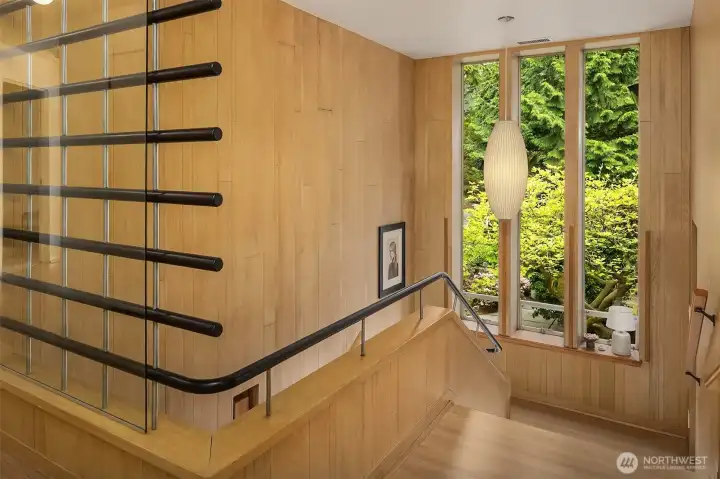 Gorgeous original solid white oak paneled staircase with original wood and metal railing details. Gorgeous original solid white oak paneled staircase with original wood and metal railing details.