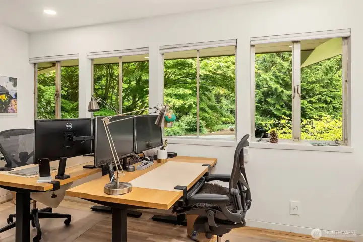 Office with room for two workstations and built-in bookcase. Four windows overlook the courtyard. Office with room for two workstations and built-in bookcase. Four windows overlook the courtyard.