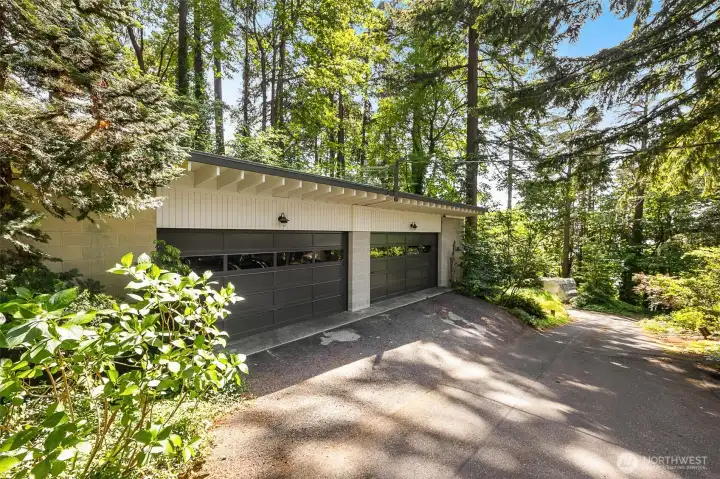 Heated detached four car garage/workshop across from attached two car garage Heated detached four car garage/workshop across from attached two car garage