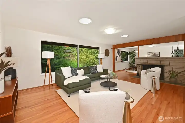 Living room with big window overlooking rear yard.