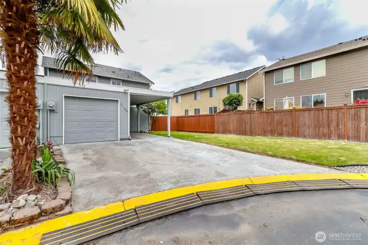Abundant parking with an oversized one car garage, a one car carport, plus 2 driveway spots! And look at that palm tree!!