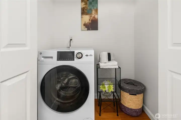 New GE washer/dryer combined unit with heat pump fits efficiently in entryway closet with space to imagine your laundry center.