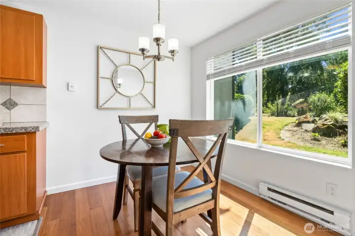 Bright dining area, with view into gardens.