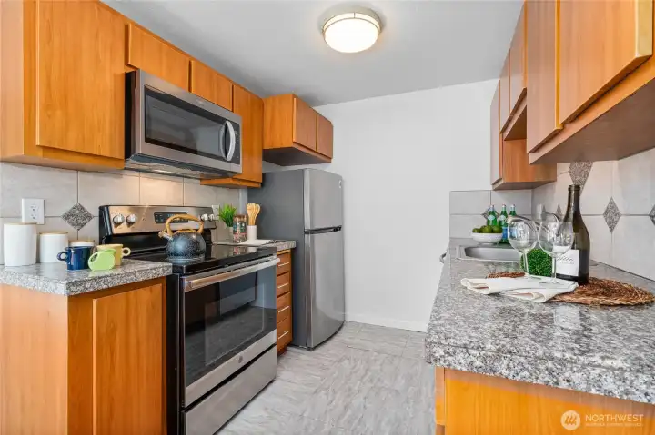 Stainless steel glass cooktop stove, refrigerator, dishwasher, microwave oven and garbage disposal