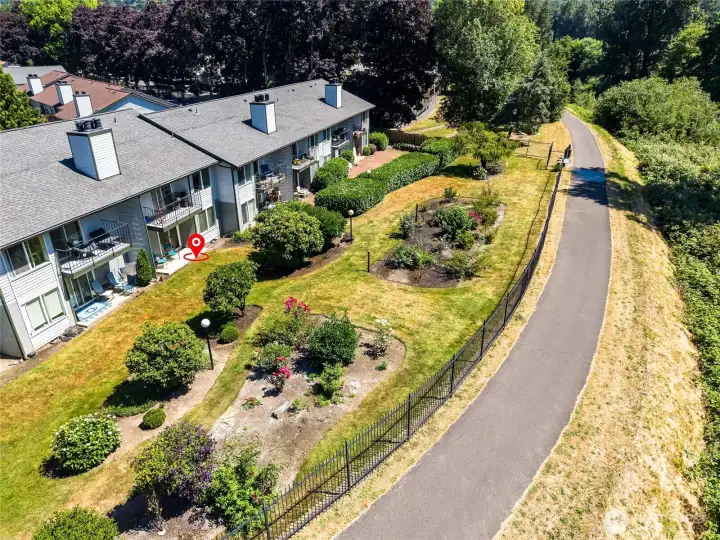 Aerial view of yard, flower beds and trail. Great for walking or riding.